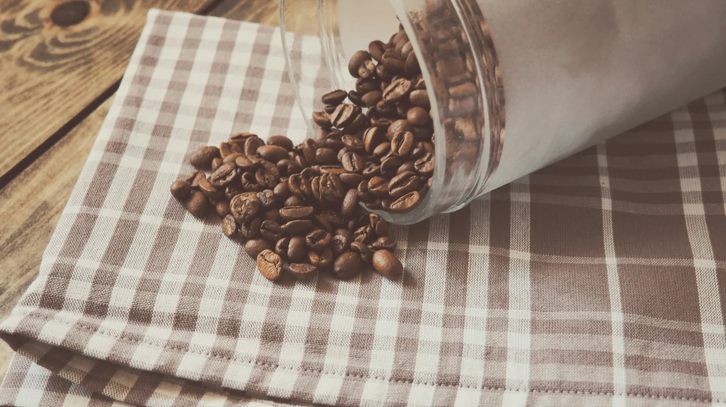 Coffee beans stored in a glass jar on a table