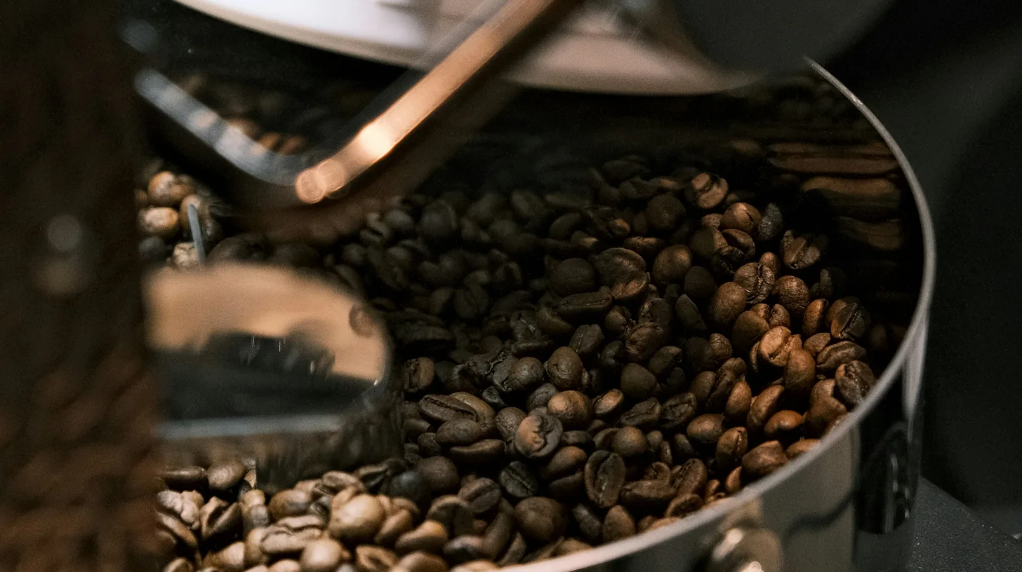 Coffee beans tumbling inside a roasting machine